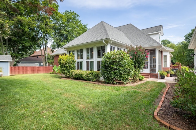 835 Banner Dr, Murfreesboro, TN 37129 - view of property exterior with a sunroom, a shingled roof, and brick siding