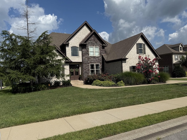 1125 Tiberius Way, Murfreesboro, TN 37128 - view of front facade featuring stone siding, french doors, and a front yard