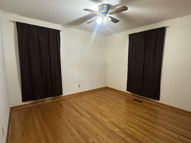 638 Chitwood Dr, Lafayette, TN 37083 - empty room featuring wood finished floors, ceiling fan, and a textured ceiling