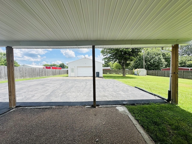 638 Chitwood Dr, Lafayette, TN 37083 - fenced backyard with an outdoor structure, a patio, and a garage