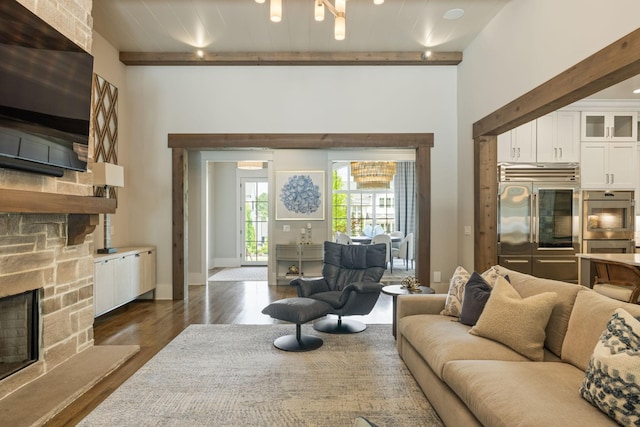 8524 Heirloom Blvd, College Grove, TN 37046 - living room featuring beamed ceiling, dark wood finished floors, and a fireplace