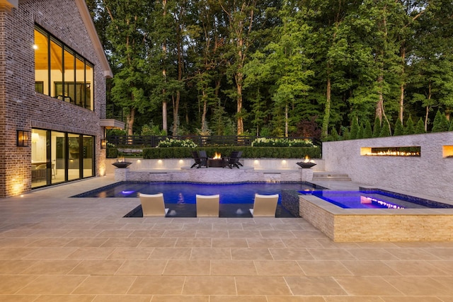 8524 Heirloom Blvd, College Grove, TN 37046 - outdoor pool with an in-ground hot tub, an outdoor fire pit, and a patio