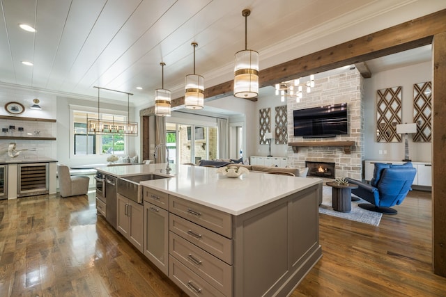 8524 Heirloom Blvd, College Grove, TN 37046 - kitchen with gray cabinets, open floor plan, a fireplace, dark wood-type flooring, and recessed lighting