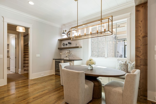 8524 Heirloom Blvd, College Grove, TN 37046 - dining room featuring ornamental molding, wood finished floors, a dry bar, wine cooler, and stairs