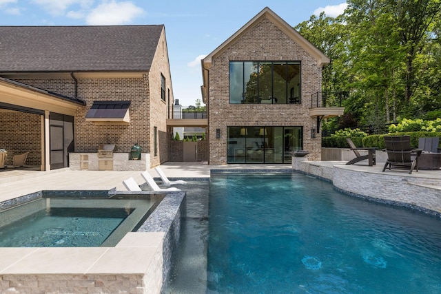 8524 Heirloom Blvd, College Grove, TN 37046 - swimming pool featuring an outdoor kitchen, a patio, and an in-ground hot tub