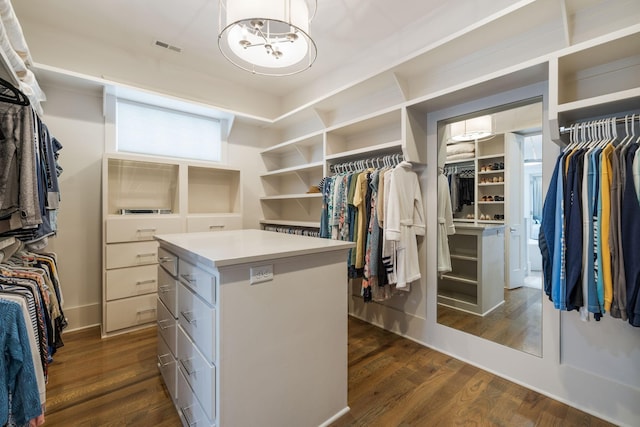 8524 Heirloom Blvd, College Grove, TN 37046 - spacious closet featuring a chandelier and dark wood finished floors