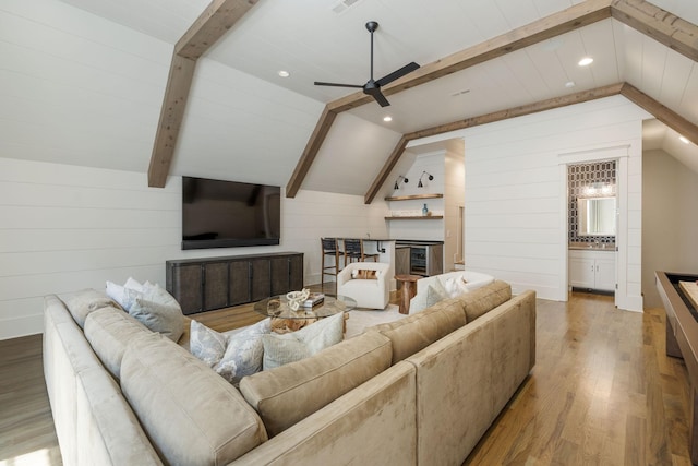 8524 Heirloom Blvd, College Grove, TN 37046 - living area with wood finished floors, a ceiling fan, wood walls, a glass covered fireplace, and recessed lighting