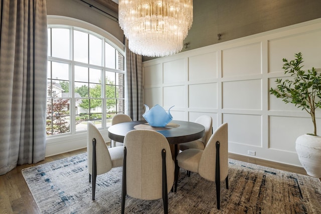 8524 Heirloom Blvd, College Grove, TN 37046 - dining area featuring a decorative wall, a chandelier, and wood finished floors