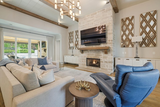 8524 Heirloom Blvd, College Grove, TN 37046 - living area with beam ceiling, a fireplace, wood finished floors, and a chandelier