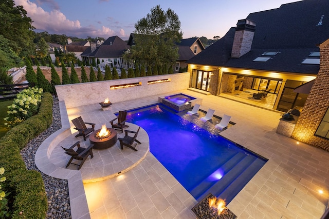 8524 Heirloom Blvd, College Grove, TN 37046 - view of swimming pool with a fire pit, a patio, a pool with connected hot tub, and a fenced backyard