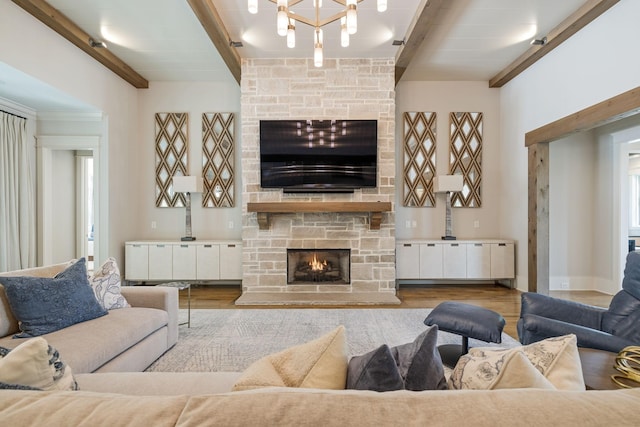 8524 Heirloom Blvd, College Grove, TN 37046 - living area featuring a stone fireplace, beam ceiling, wood finished floors, and a chandelier
