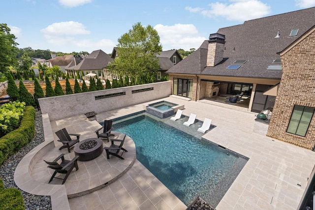 8524 Heirloom Blvd, College Grove, TN 37046 - view of swimming pool with an outdoor fire pit, a patio area, a pool with connected hot tub, and a residential view