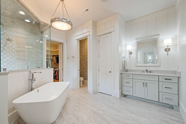 8524 Heirloom Blvd, College Grove, TN 37046 - bathroom with a freestanding tub, vanity, a tile shower, a walk in closet, and marble finish floors