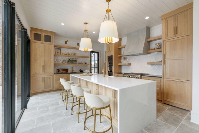 8524 Heirloom Blvd, College Grove, TN 37046 - kitchen featuring open shelves, tasteful backsplash, a kitchen island with sink, custom exhaust hood, and recessed lighting