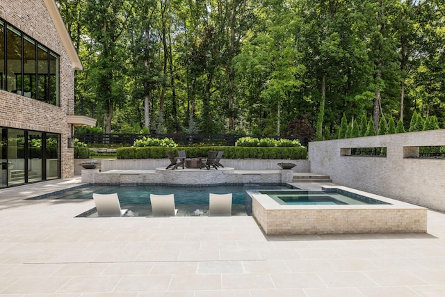 8524 Heirloom Blvd, College Grove, TN 37046 - view of swimming pool featuring an in-ground hot tub, a patio, and a fire pit