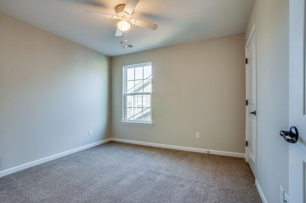 107 Clavie Crew Ln, Spring Hill, TN 37174 - empty room with carpet and a ceiling fan
