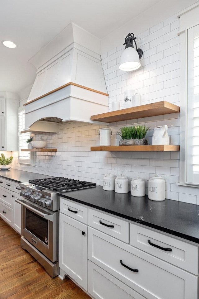 212 Rich Cir, Franklin, TN 37064 - kitchen with open shelves, stainless steel range, decorative backsplash, dark countertops, and recessed lighting
