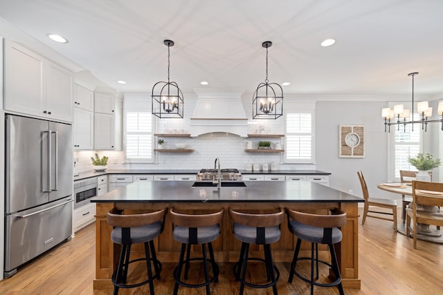 212 Rich Cir, Franklin, TN 37064 - kitchen with a chandelier, dark countertops, stainless steel appliances, open shelves, and recessed lighting