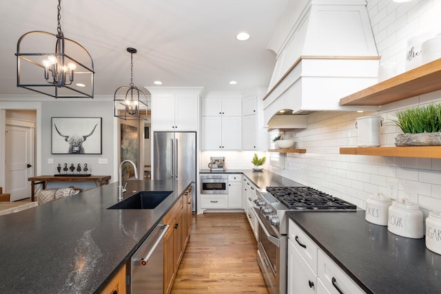 212 Rich Cir, Franklin, TN 37064 - kitchen with open shelves, stainless steel appliances, a chandelier, decorative light fixtures, and backsplash