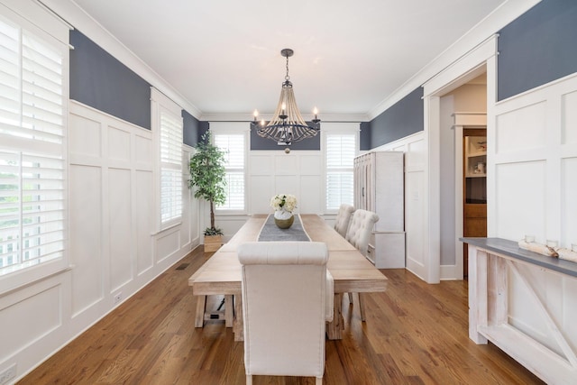 212 Rich Cir, Franklin, TN 37064 - dining area featuring a decorative wall, a chandelier, crown molding, and wood finished floors
