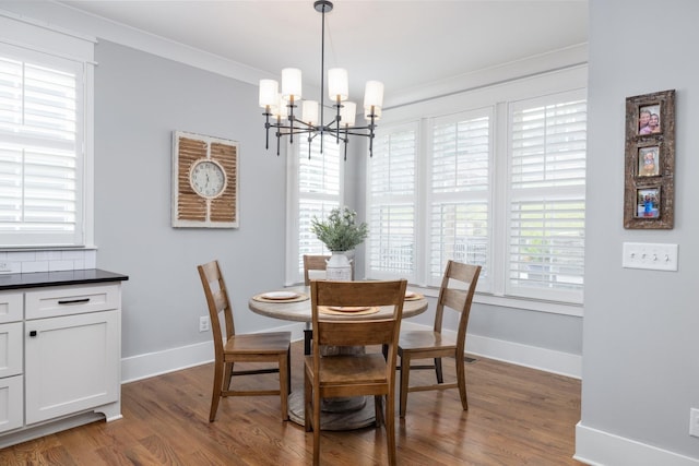 212 Rich Cir, Franklin, TN 37064 - dining area with a chandelier, dark wood-style floors, and ornamental molding