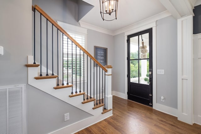 212 Rich Cir, Franklin, TN 37064 - foyer entrance with a chandelier, stairway, wood finished floors, and ornamental molding