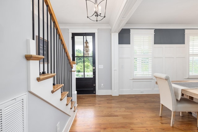 212 Rich Cir, Franklin, TN 37064 - entrance foyer featuring a decorative wall, a chandelier, wood finished floors, stairs, and ornamental molding