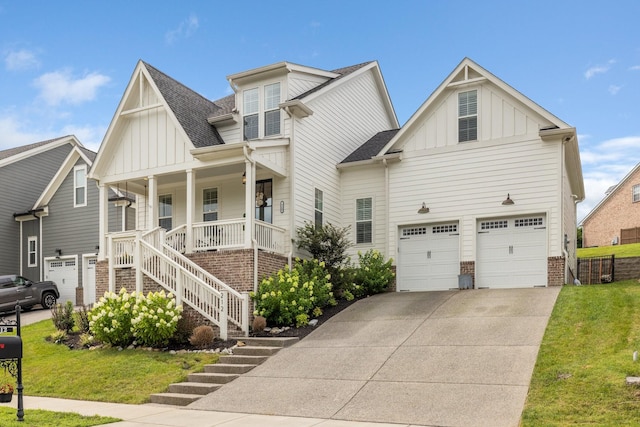 212 Rich Cir, Franklin, TN 37064 - view of front facade with board and batten siding, a porch, a shingled roof, and driveway