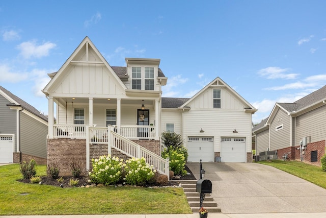 212 Rich Cir, Franklin, TN 37064 - view of front of house featuring board and batten siding, concrete driveway, a garage, a porch, and a front yard