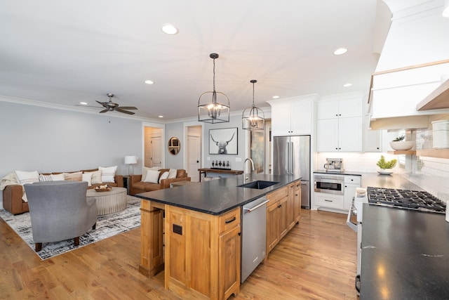 212 Rich Cir, Franklin, TN 37064 - kitchen with dark countertops, ornamental molding, premium appliances, backsplash, and recessed lighting