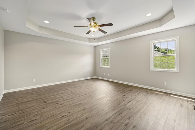 92 Defeated Creek Hwy, Carthage, TN 37030 - empty room with a tray ceiling, plenty of natural light, ceiling fan, dark wood finished floors, and recessed lighting