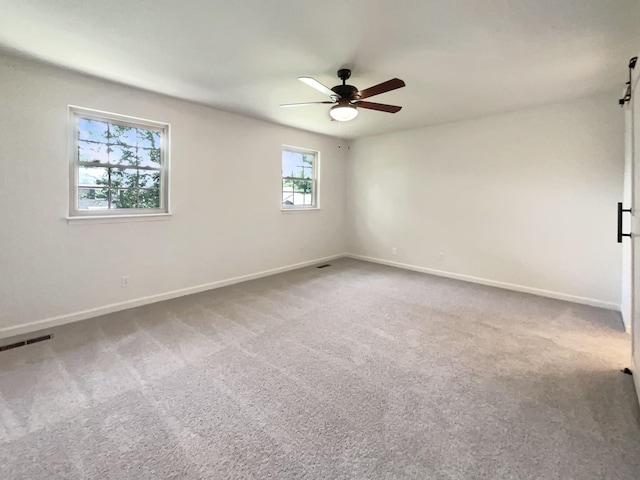 1002 E Northfield Blvd Unit H104, Murfreesboro, TN 37130 - empty room with carpet flooring, ceiling fan, and a barn door