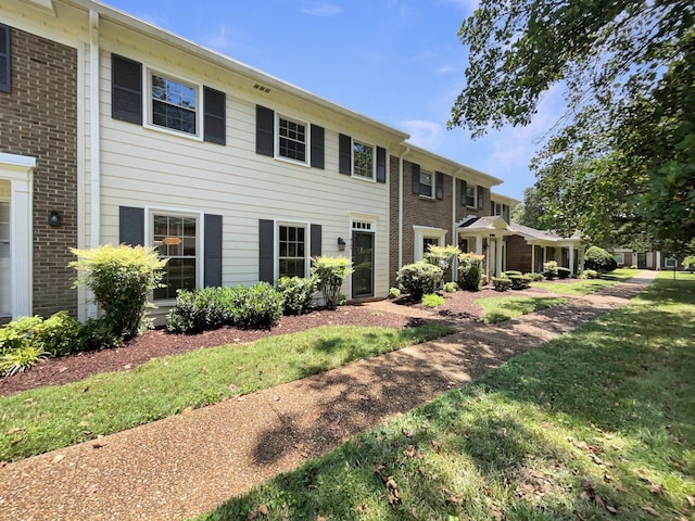 1002 E Northfield Blvd Unit H104, Murfreesboro, TN 37130 - back of property featuring brick siding and a yard