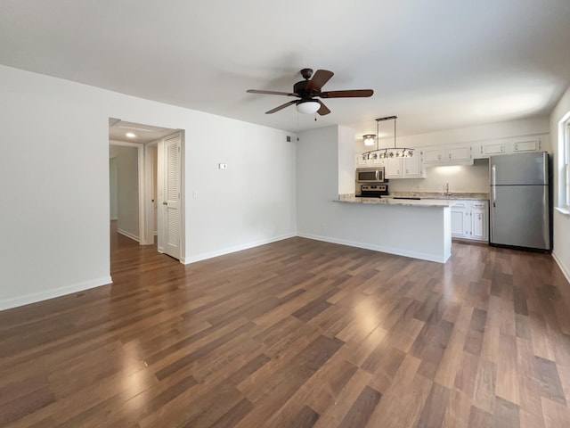 1002 E Northfield Blvd Unit H104, Murfreesboro, TN 37130 - unfurnished living room with ceiling fan and dark wood finished floors