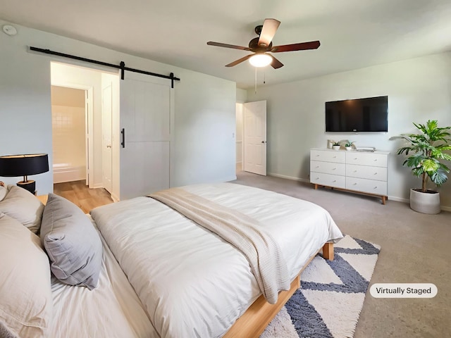 1002 E Northfield Blvd Unit H104, Murfreesboro, TN 37130 - bedroom with a barn door and ceiling fan