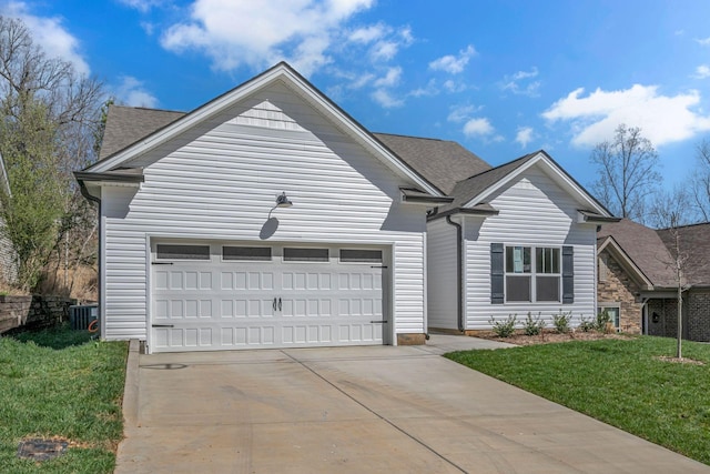 209 E Quail Hollow Way, Dickson, TN 37055 - view of front of home with driveway, an attached garage, a front yard, and roof with shingles