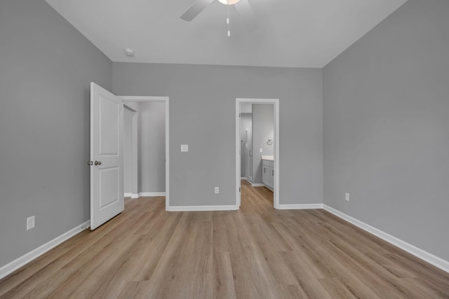 209 E Quail Hollow Way, Dickson, TN 37055 - unfurnished bedroom featuring light wood-style floors, ensuite bath, and a ceiling fan