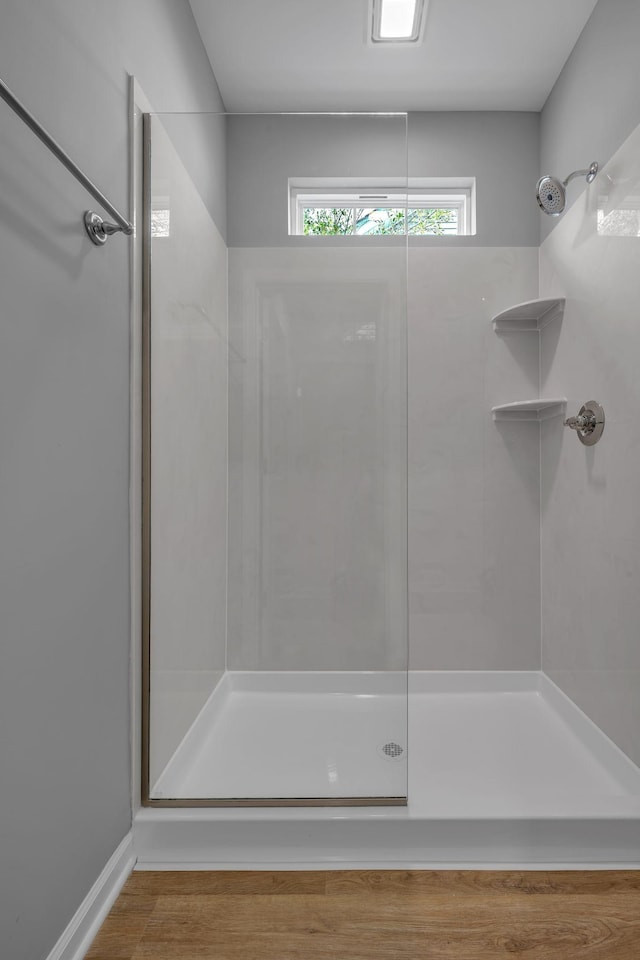 209 E Quail Hollow Way, Dickson, TN 37055 - bathroom featuring a shower and wood finished floors