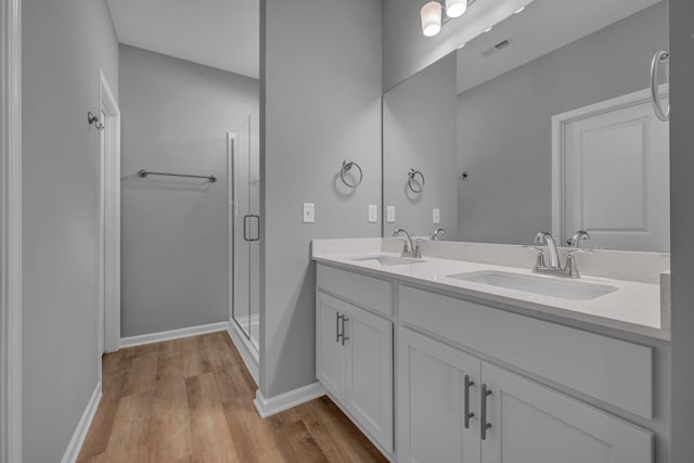 209 E Quail Hollow Way, Dickson, TN 37055 - full bath featuring double vanity, wood finished floors, and a shower stall