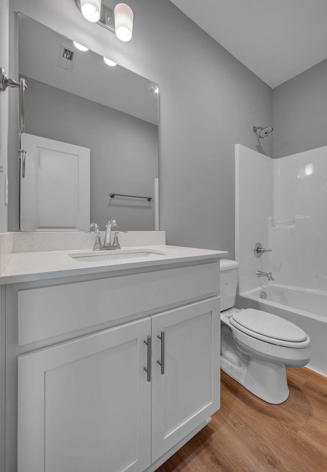 209 E Quail Hollow Way, Dickson, TN 37055 - full bath featuring vanity, wood finished floors, and shower / bath combination