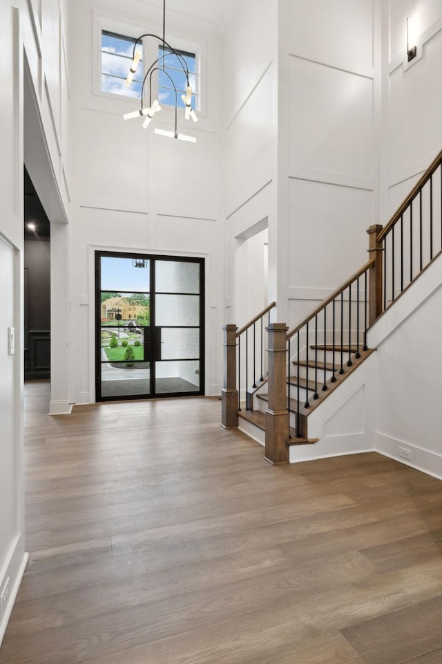 512 Wilson Pike, Brentwood, TN 37027 - entryway with a towering ceiling, stairs, a chandelier, plenty of natural light, and wood finished floors