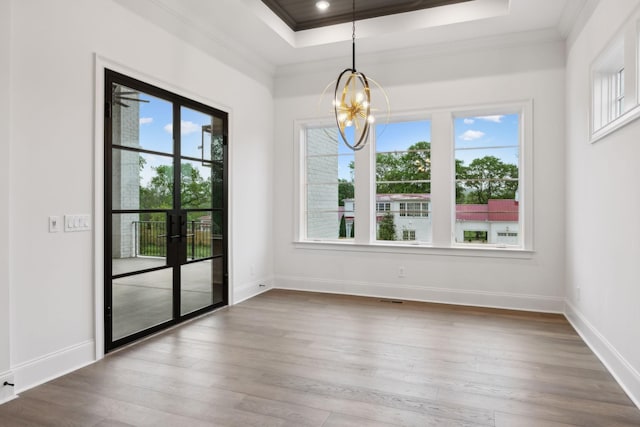 512 Wilson Pike, Brentwood, TN 37027 - unfurnished dining area featuring plenty of natural light, a chandelier, crown molding, and a tray ceiling