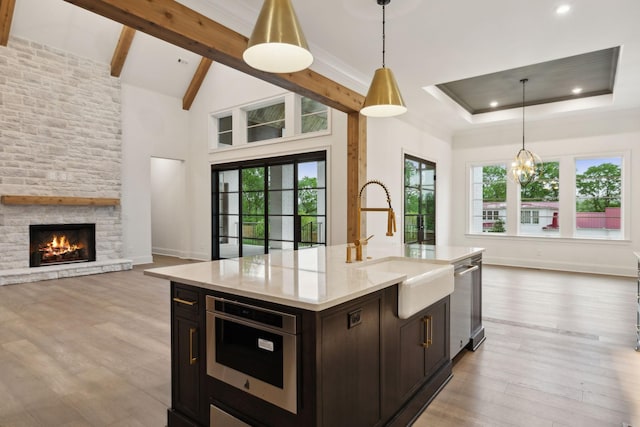 512 Wilson Pike, Brentwood, TN 37027 - kitchen featuring open floor plan, healthy amount of natural light, recessed lighting, hanging light fixtures, and light wood-style flooring