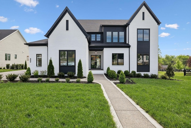 512 Wilson Pike, Brentwood, TN 37027 - modern farmhouse with brick siding, a front yard, and roof with shingles