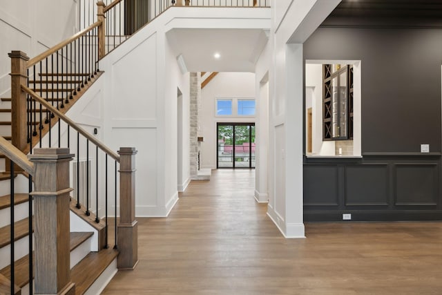 512 Wilson Pike, Brentwood, TN 37027 - entryway featuring a decorative wall, wood finished floors, a high ceiling, stairway, and recessed lighting