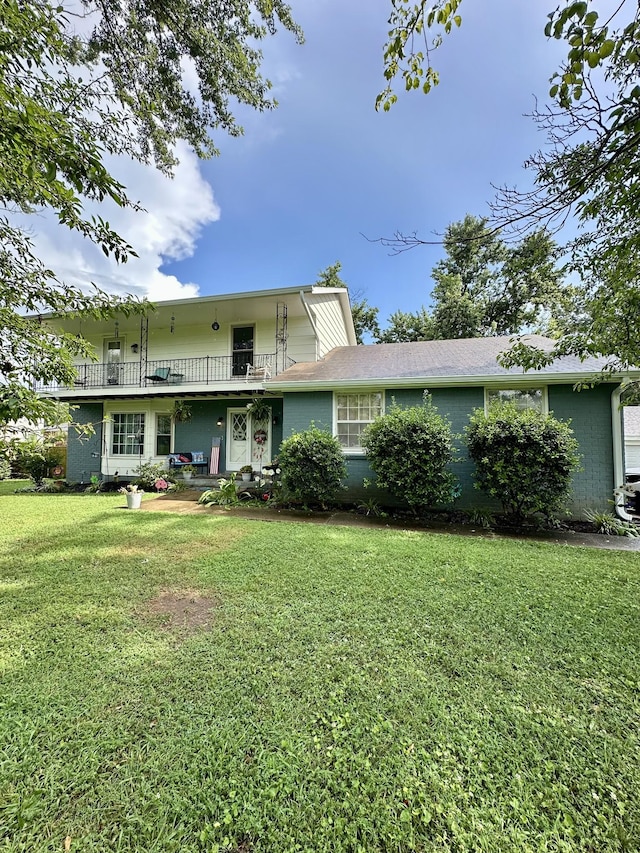 108 Austin Ave, Smyrna, TN 37167 - rear view of property featuring a lawn, brick siding, and a balcony