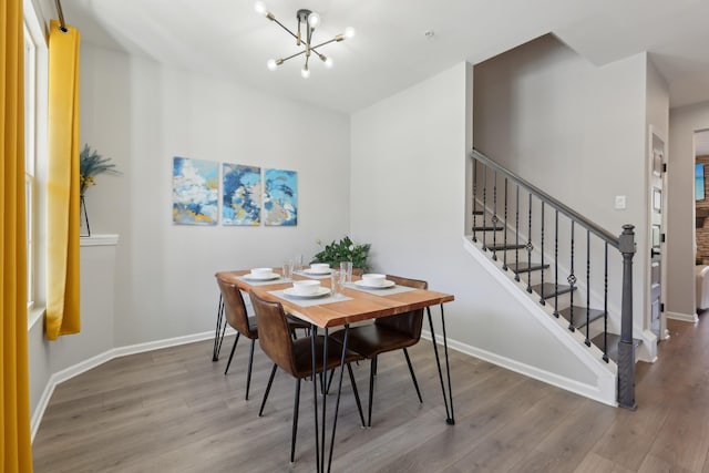 3225 Brookberry Ln, Murfreesboro, TN 37129 - dining area featuring wood finished floors, a chandelier, and stairs