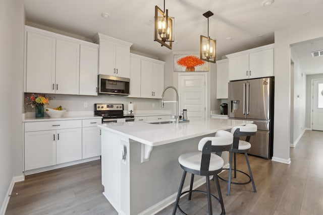 3225 Brookberry Ln, Murfreesboro, TN 37129 - kitchen with stainless steel appliances, an island with sink, and white cabinets