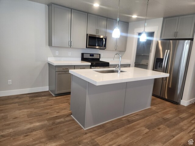 9786 N Aaron Ave E Unit 221, Eagle Mountain, UT 84005 - kitchen with stainless steel appliances, gray cabinetry, baseboards, and a sink