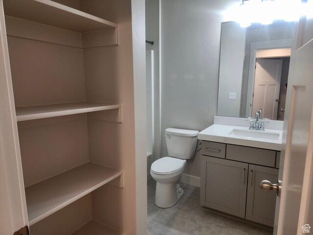 9786 N Aaron Ave E Unit 221, Eagle Mountain, UT 84005 - full bathroom featuring toilet, vanity, tile patterned flooring, and  shower combination